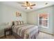 Guest bedroom with double bed and window at 200 Grand Canal Dr, Kissimmee, FL 34759