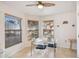 Bright dining area with glass table, chairs, and large windows at 200 Grand Canal Dr, Kissimmee, FL 34759