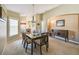 Dining room features a glass-top table and wood chairs at 200 Grand Canal Dr, Kissimmee, FL 34759
