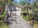 Home with a brick paver driveway and two-car garage at 200 Grand Canal Dr, Kissimmee, FL 34759