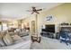Living room features ample seating and a home office area at 200 Grand Canal Dr, Kissimmee, FL 34759