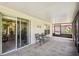 Screened patio with tiled flooring, table and chairs, and access to interior at 200 Grand Canal Dr, Kissimmee, FL 34759