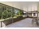 Spacious screened porch with tiled floor and wooded views at 200 Grand Canal Dr, Kissimmee, FL 34759