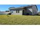 Spacious backyard with grassy lawn and grilling area at 2914 Scarlett Dr, Saint Cloud, FL 34772