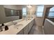 Double vanity bathroom with a large walk-in shower and neutral tile at 2914 Scarlett Dr, Saint Cloud, FL 34772