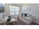 Cozy bedroom with a daybed, built-in drawers, and a workspace at 2914 Scarlett Dr, Saint Cloud, FL 34772
