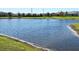 Sparkling pond view, serene water feature, and green landscaping at 2914 Scarlett Dr, Saint Cloud, FL 34772