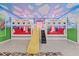 bedroom with bunk beds, a slide, and a Mickey Mouse theme at 3000 Penelope Loop, Kissimmee, FL 34746