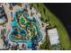 Aerial view of resort-style pool, lazy river, and sand volleyball court at 3151 Paradox Cir # 201, Kissimmee, FL 34746