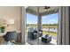 Private balcony overlooking a lake with outdoor seating at 3151 Paradox Cir # 201, Kissimmee, FL 34746