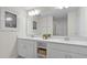 Modern bathroom with double vanity and large mirror at 3151 Paradox Cir # 201, Kissimmee, FL 34746