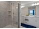 Clean bathroom with a walk-in shower and double vanity at 3151 Paradox Cir # 201, Kissimmee, FL 34746