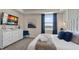 Spacious bedroom with large TV, dresser, and comfortable king-size bed at 3151 Paradox Cir # 201, Kissimmee, FL 34746