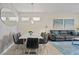 Elegant dining area with a marble table and seating for eight at 3151 Paradox Cir # 201, Kissimmee, FL 34746