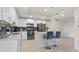 Modern kitchen with white cabinets, stainless steel appliances, and island at 3151 Paradox Cir # 201, Kissimmee, FL 34746