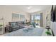 Relaxing living room with comfortable couch and access to balcony at 3151 Paradox Cir # 201, Kissimmee, FL 34746