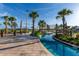 Lazy river with rope bridge and lush tropical landscaping at 3151 Paradox Cir # 201, Kissimmee, FL 34746