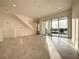 Bright living room with tile floors and balcony access at 9778 Bucklow Hill Dr, Orlando, FL 32832