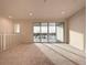 Spacious bedroom with balcony access and carpeted floors at 9778 Bucklow Hill Dr, Orlando, FL 32832