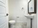 Clean powder room with pedestal sink and tiled floor at 9778 Bucklow Hill Dr, Orlando, FL 32832