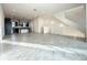 Open concept living room and kitchen with gray tile floors at 9778 Bucklow Hill Dr, Orlando, FL 32832
