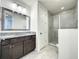 Bathroom boasts granite countertop and walk-in shower at 9778 Bucklow Hill Dr, Orlando, FL 32832