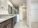 Bathroom features a double vanity, granite countertops and a walk-in shower at 9778 Bucklow Hill Dr, Orlando, FL 32832