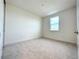 Well-lit bedroom featuring neutral wall colors and carpet at 9778 Bucklow Hill Dr, Orlando, FL 32832