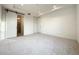 Spacious bedroom with plush carpeting and a barn door leading to the bathroom at 9778 Bucklow Hill Dr, Orlando, FL 32832
