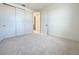 Bedroom with carpet, doors to closet and hallway at 9778 Bucklow Hill Dr, Orlando, FL 32832