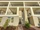 Contemporary townhome building with multiple units and brick accents at 9778 Bucklow Hill Dr, Orlando, FL 32832