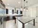 Granite countertops and stainless steel appliances highlight this kitchen at 9778 Bucklow Hill Dr, Orlando, FL 32832