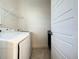 Laundry room with washer, dryer, and shelving at 9778 Bucklow Hill Dr, Orlando, FL 32832