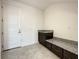 Laundry room with built-in bench and cabinetry at 9778 Bucklow Hill Dr, Orlando, FL 32832