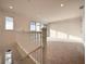Spacious loft area with large windows and balcony access at 9778 Bucklow Hill Dr, Orlando, FL 32832