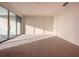Large bedroom with carpeted floors and balcony access at 9778 Bucklow Hill Dr, Orlando, FL 32832