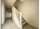 Modern staircase with white railing and carpeted steps at 9778 Bucklow Hill Dr, Orlando, FL 32832