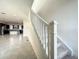 Open staircase overlooking kitchen and living areas at 9778 Bucklow Hill Dr, Orlando, FL 32832