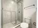 Modern shower with grey tile and glass enclosure at 9778 Bucklow Hill Dr, Orlando, FL 32832