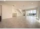 Spacious living area with tile floors and access to a balcony at 9778 Bucklow Hill Dr, Orlando, FL 32832