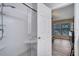 Clean bathroom with a herringbone-tiled shower and a glass door at 10106 Pink Carnation Ct, Orlando, FL 32825