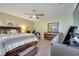 Primary bedroom with king bed and ample natural light at 10106 Pink Carnation Ct, Orlando, FL 32825