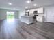 Modern kitchen with stainless steel appliances and an island at 1030 Darlington Ct, Kissimmee, FL 34758