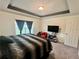 Spacious main bedroom with large bed and TV at 119 Summerlin Loop, Haines City, FL 33844