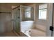 Bathroom features a walk-in shower and garden tub at 1270 Ballyshannon Pkwy., Orlando, FL 32828