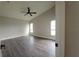 Spacious bedroom with wood-look floors and large windows at 1270 Ballyshannon Pkwy., Orlando, FL 32828