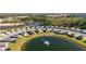 Aerial view of community with lake and houses at 17630 Blazing Star Cir, Clermont, FL 34714