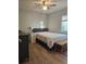 Bright bedroom with a queen-size bed and neutral color scheme at 190 N Lake Ct, Kissimmee, FL 34743