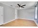 Simple bedroom with wood floors and ceiling fan at 205 9Th St, Saint Cloud, FL 34769