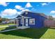 Cute blue house with a covered porch and a fenced yard at 205 9Th St, Saint Cloud, FL 34769